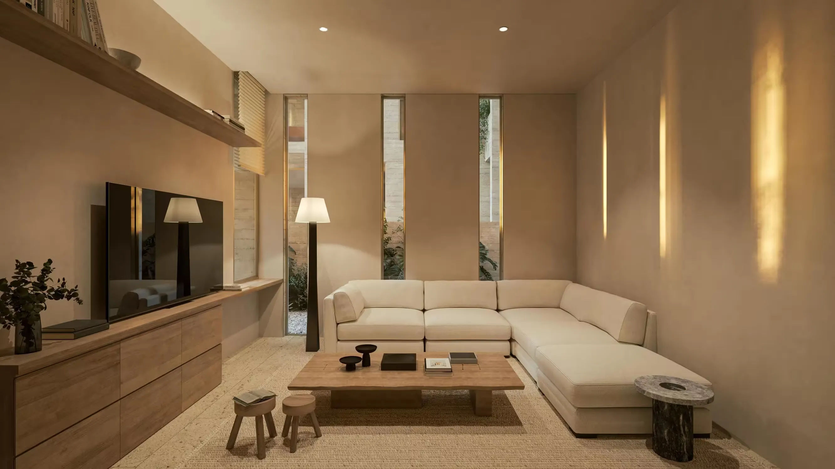 Patio vegetal a doble altura que atraviesa el edificio